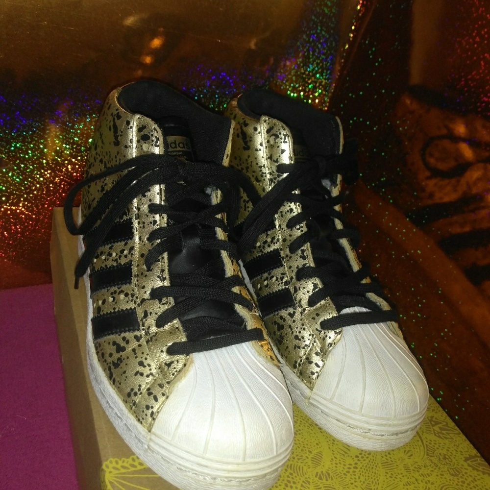 Black and gold superstar Adidas original sneaker